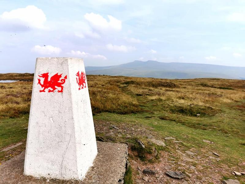 Trig point with Welsh dragon