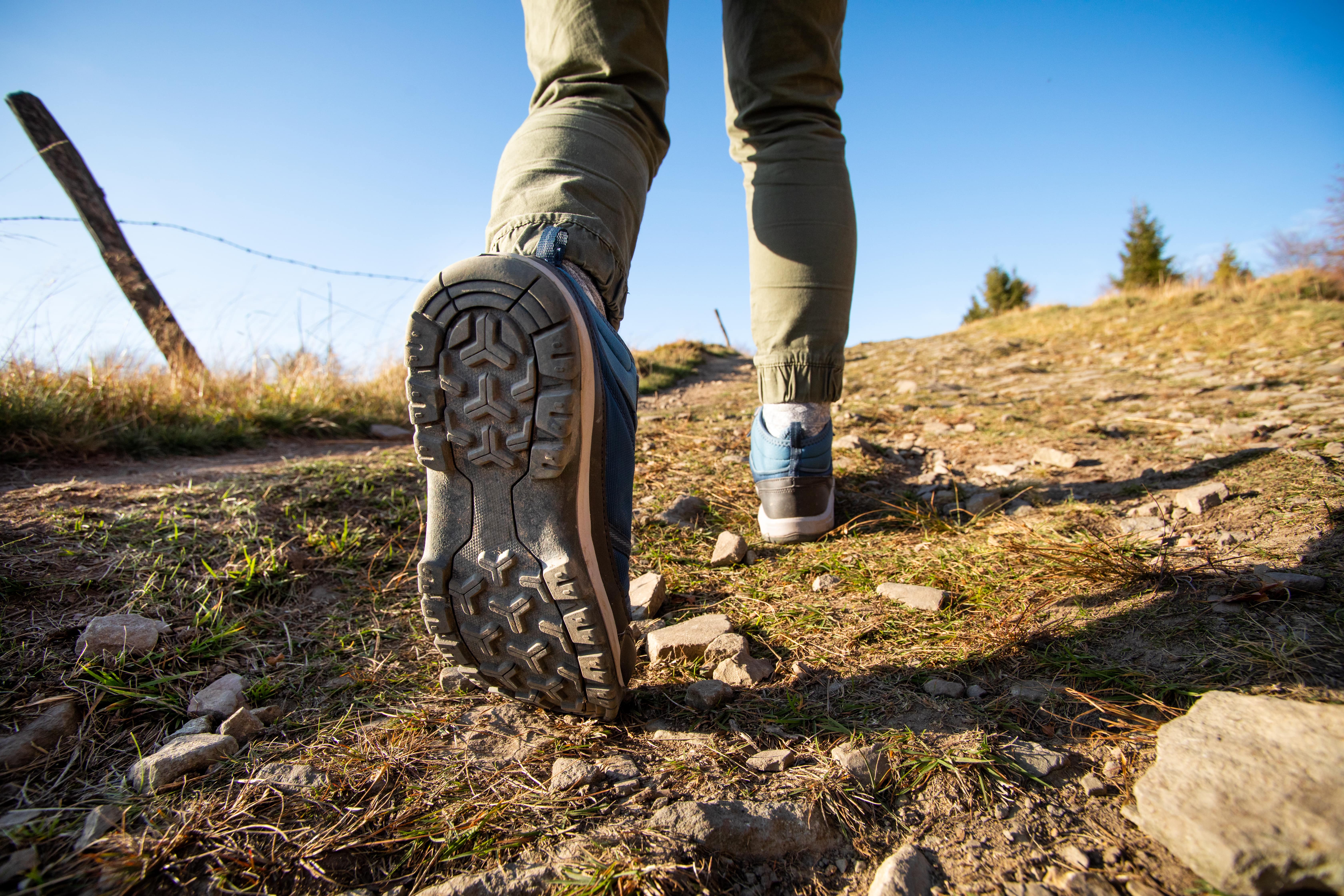 walking and hiking boots on rocky terrain 
